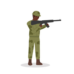 Obraz premium Black soldier in spotted camouflage uniform and baseball cap shoots rifle standing up. Weapons in outstretched hands. 