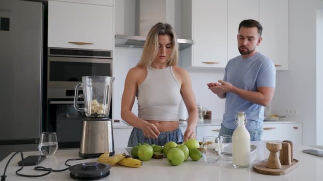  Couple Preparing Healthy Smoothie Together in Bright Modern Kitchen