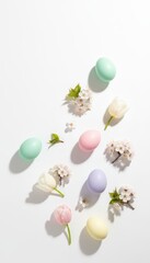 Obraz premium Colorful Easter Eggs and Blossoms on White Background