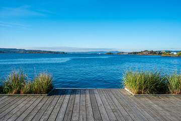 Oslo Norway deck waterfront with sea sky horizon and grass foreground creating tranquil space in minimal landscape for travel use summer