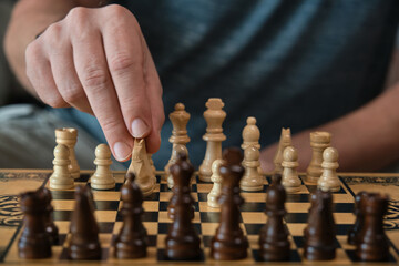 the hand moves the chess pieces