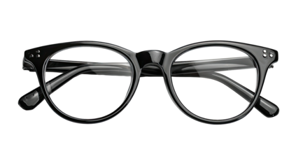 Close-up of black-framed eyeglasses set against a black background