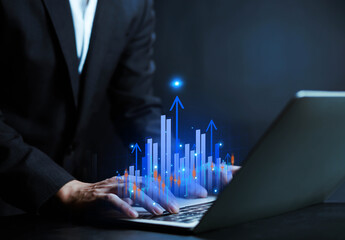 Businessman hand drawing glowing financial chart with rising bar graph and market data. Concept of investment growth, stock market analysis, trading strategy, financial success, and digital economy. 