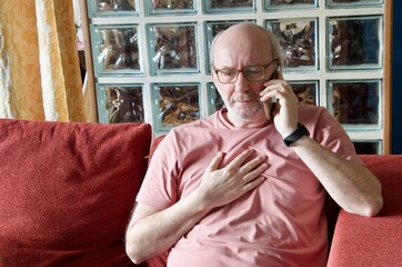 Senior man experiencing chest pain calling for help