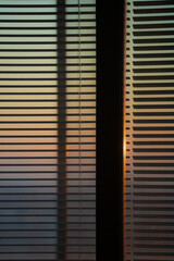Morning sunlight streaming through the blinds