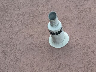 Gas boiler pipe is sticking out of the wall of the house