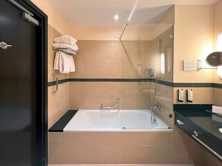 Bright bathroom featuring freestanding bathtub