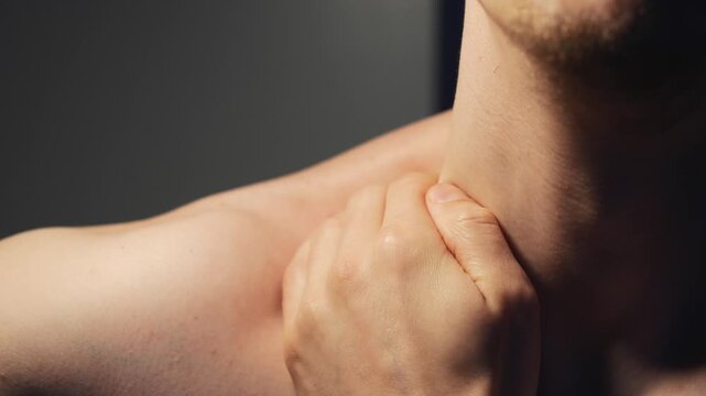 A person massages their shoulder.
Trapezius muscle, body parts.
A person massages their shoulder and collarbone with their hands to relieve pain.
Clavicle, pain, spasm, strain, anatomy