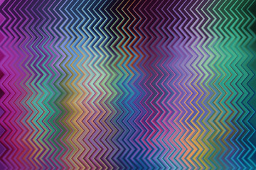 Vibrant purple and teal zigzag pattern abstract background with a neon digital glitch effect for futuristic and creative graphic design.