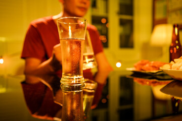 A blurry image of businessmen at a lavish office party.