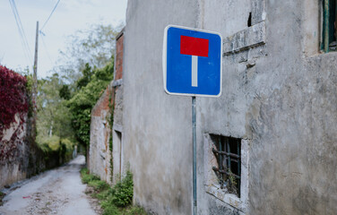 Dead-end street sign in an old rustic setting