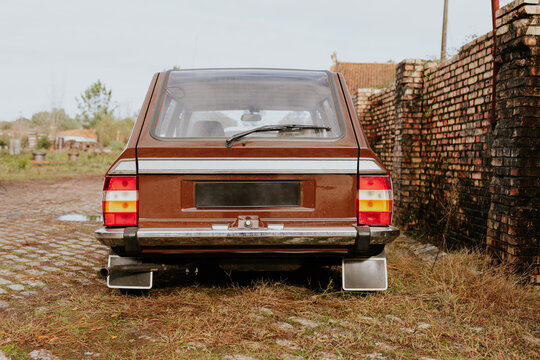 Vintage car with rustic background and brick wall