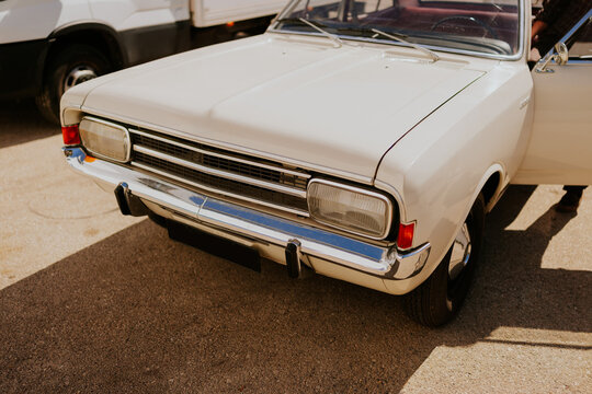 Classic white car parked on a sunny day