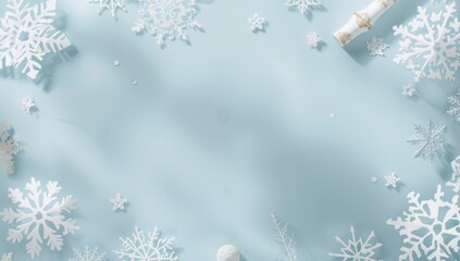 Close-up of handmade paper snowflakes arranged on pastel blue background, seasonal winter decor elements, holiday craft