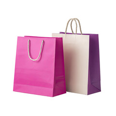 Two colorful, empty shopping bags with string handles against a black background