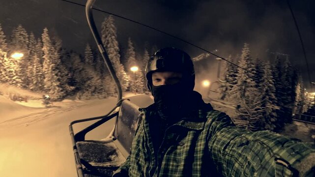 Snowboarding at night in the mountains captures thrills and winter vibes