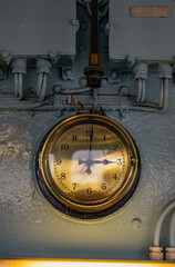 Leith, Edinburgh, Scotland: a gold watch in the dashboard of Her Majesty's Royal Yacht Britannia (1954-1997), the former royal yacht of the British monarchy now permanently berthed at Ocean Terminal
