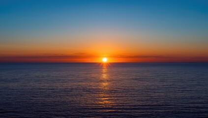 Obraz premium Sunset over the Baltic coast in winter, tranquil scene with low temperatures, seasonal change, Earth Day