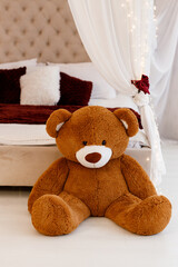 Cute Teddy Bear in Cozy Bedroom Interior