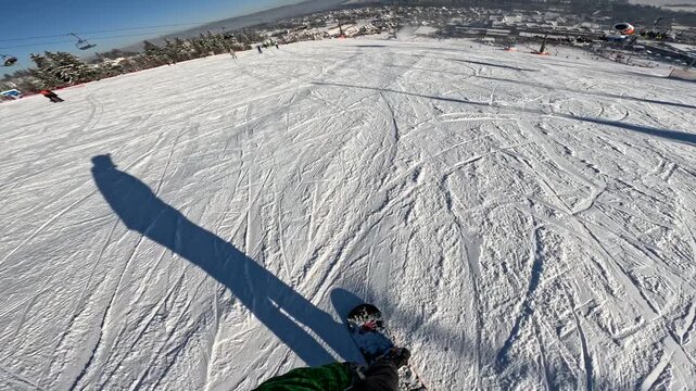 Snowboarding on a mountain slope during daytime in winter