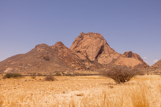 Rocky desert landscape in Namibia under clear sky