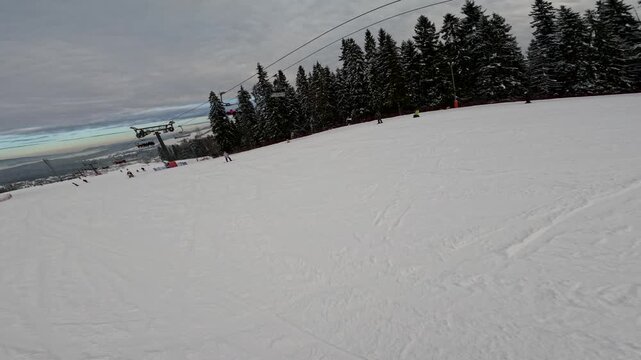 Skiing and snowboarding at a mountain resort in winter