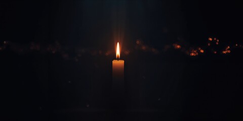 Candle flame glowing in darkness, representing hope amidst despair, World Malaria Day
