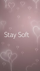 Delicate pink hearts with stay soft text, emotional warmth, gentle minimalist phone wallpaper.