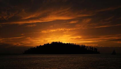 Naklejka premium Bright sunset casting warm hues over treetops against a dark sky, autumn transition