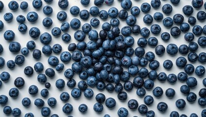 Blueberries laid out on a white surface, highlighting natural health benefits and dietary choices, Nutrition Awareness Week