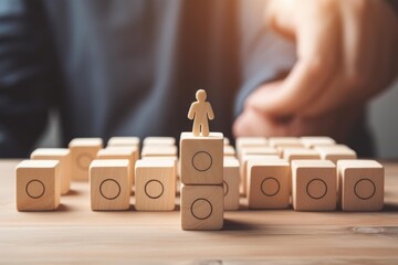 Wooden figure standing on blocks representing a leader guiding a team or group