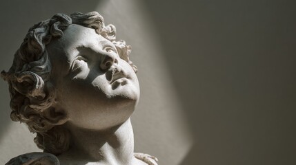 Inspiration and growth concept shown by a serene marble sculpture of a cherub with curly hair gazing upward. A timeless piece evoking peace, wonder, and continuous learning.