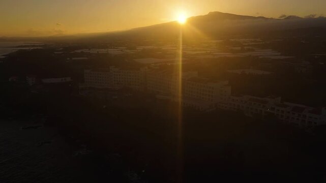 Aerial view in front of a resort, Mt Hallasan background, sunset in Jeju, Korea