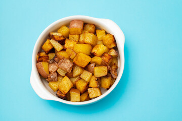 Fried potato in white bowl