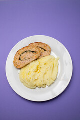 Delicious sliced chicken roll with spinach and cheese and mashed potatos