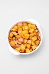Fried potato in white bowl