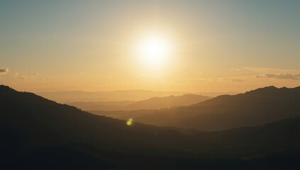 Fototapeta premium Sunlit mountain range under a clear sky, suited for scenic landscape backgrounds