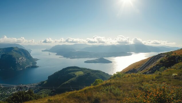 Bergen cityscape seen from Ulriken, mountain summit with cleared morning fog, tourism setting