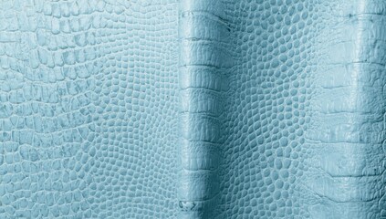 Macro view of sky-colored crocodile skin texture on leather, suitable for decorative upholstery or textile applications
