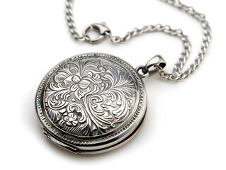 Antique silver locket with intricate floral engraving on a chain, isolated on white background