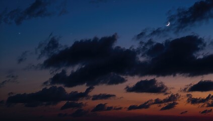 Dark cloudy sky illuminated by sunset and a crescent moon, suitable for religious observance backgrounds during Ramadan