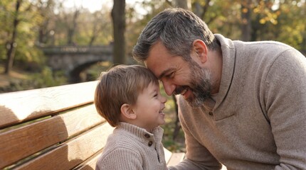 A Father and Son Sharing a Tender Moment in a Park on a Sunny Autumn Day