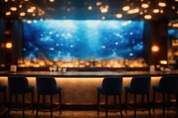 Blurred luxury hotel bar with a blue backdrop showcasing shimmering water and ambient bokeh light design