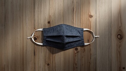 Face mask designed for virus prevention placed on wood, focusing on safety measures during health outbreaks