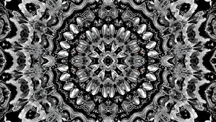 Horizontal black and white kaleidoscopic pattern serving as a backdrop for digital or print media, focusing on geometric aesthetics