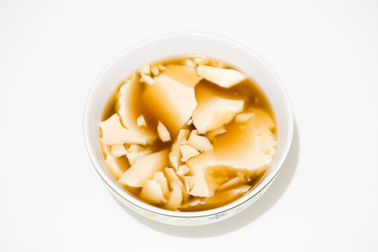 Kembang tahu is soybean pudding in ginger and palm sugar syrup, Indonesian traditional food
