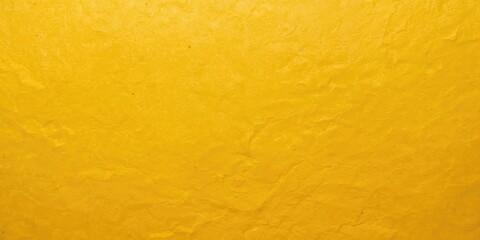 Close-up of bright yellow and orange textured paper background on dense golden kraft cardboard, ideal for layout or design projects
