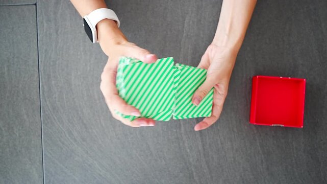 Close up of woman hands shuffling cards on desk in home office. Mental break activity, thinking process and stress relief pause within everyday work routine in real life workspace