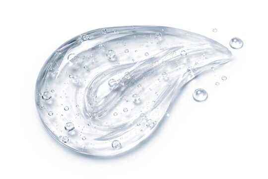 Close up macro shot of clear cosmetic gel texture from a face serum droplet on white background