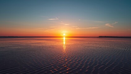 Wadden Sea sunset scene showing mudflats during low tide, highlighting natural shoreline, World Environment Day